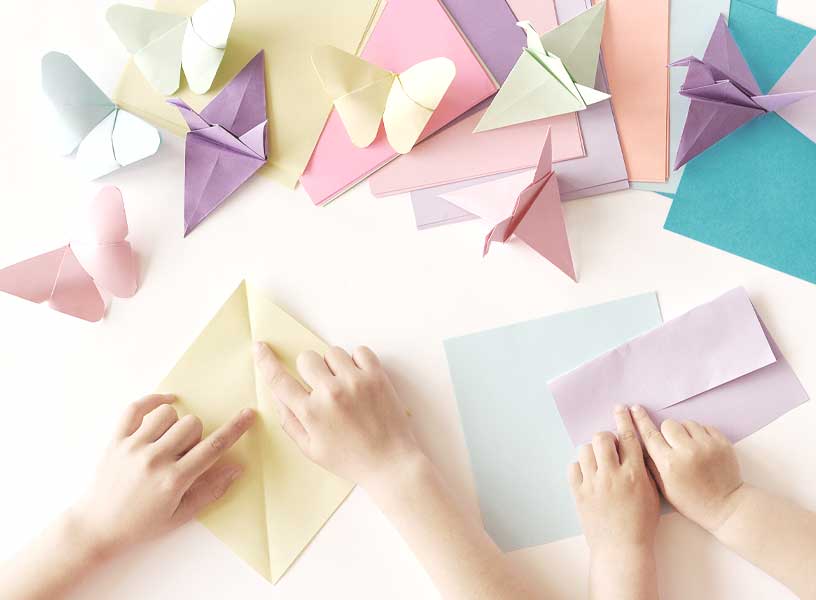 Children playing with origami